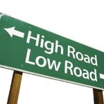 Sign showing "high road" and "low road" symbolizing the importance of good conduct in the courtroom