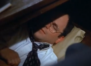Seinfeld's George Costanza napping under his office desk